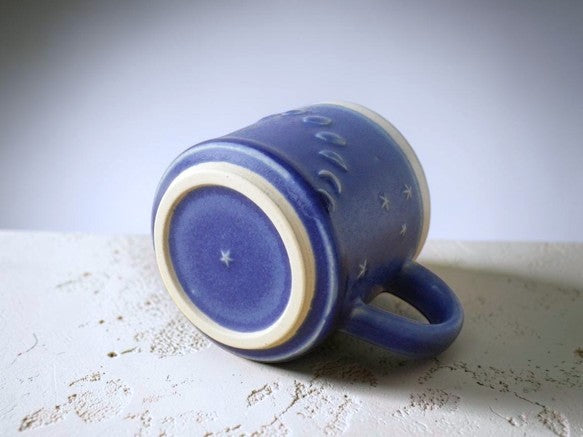 Lunar Rhythm: One-of-a-Kind Artisan Mug Embraced by the Shifting Night Sky